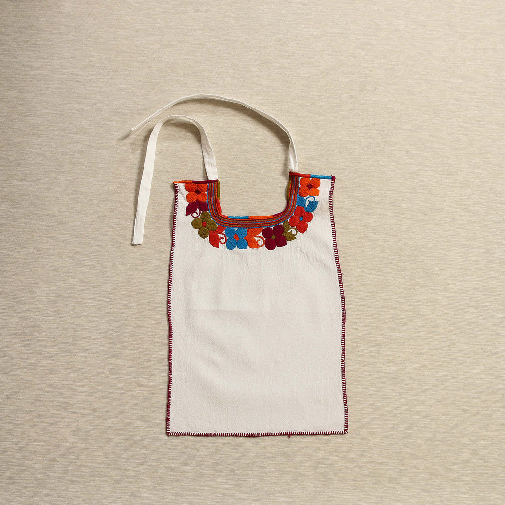 Hand embroidered bib with floral motif, Oaxaca Mexico