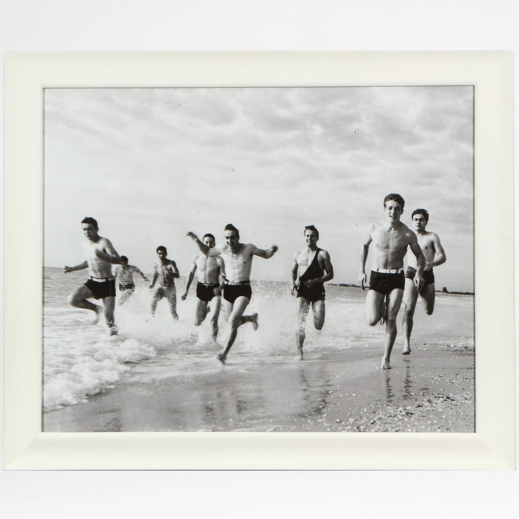 Lifeguards running on the beach