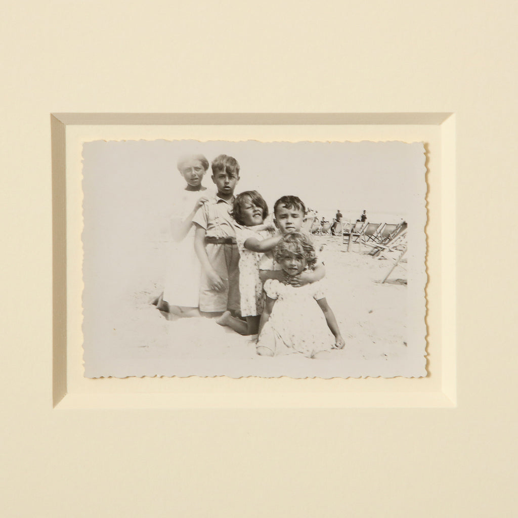 Vintage photo of kids on the beach circa 1950