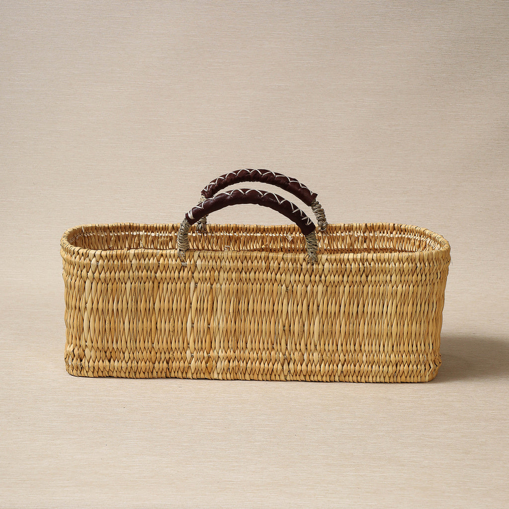 Large oblong low basket with leather handles