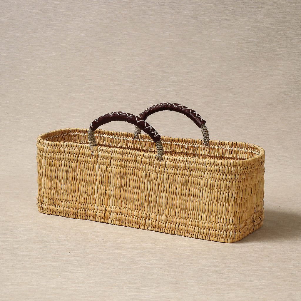 Large oblong low basket with leather handles