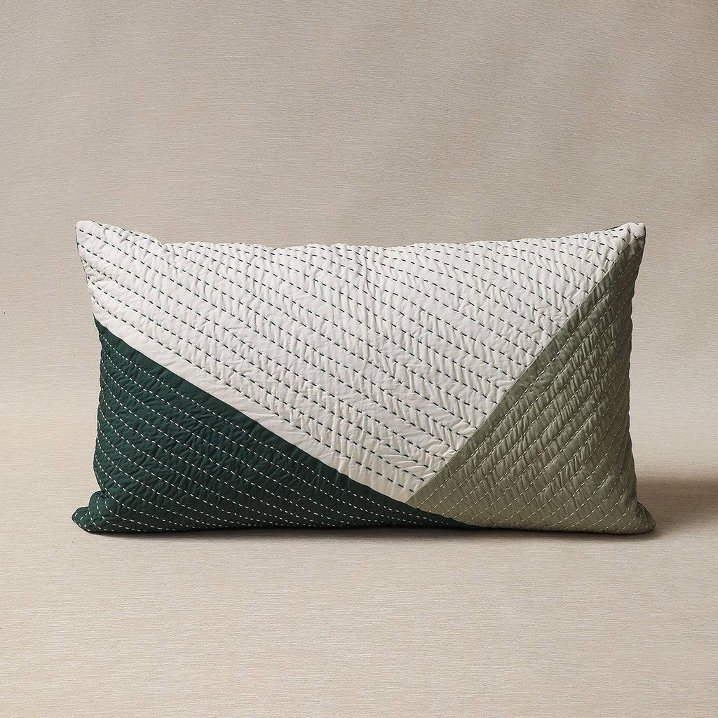 Quilted pillow in greens