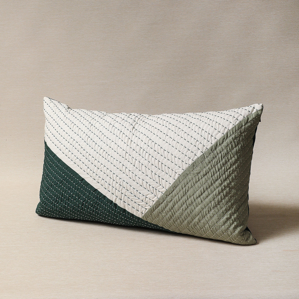 Quilted pillow in greens