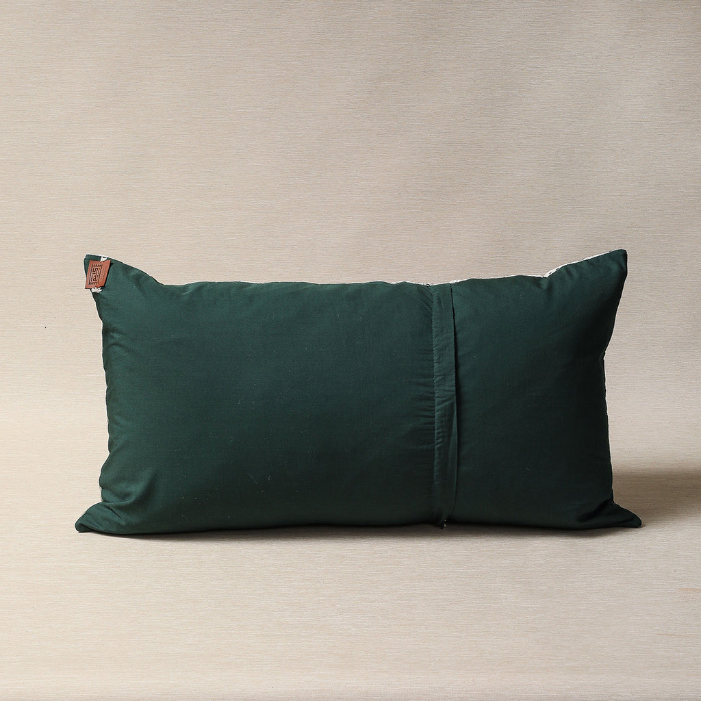 Quilted pillow in greens