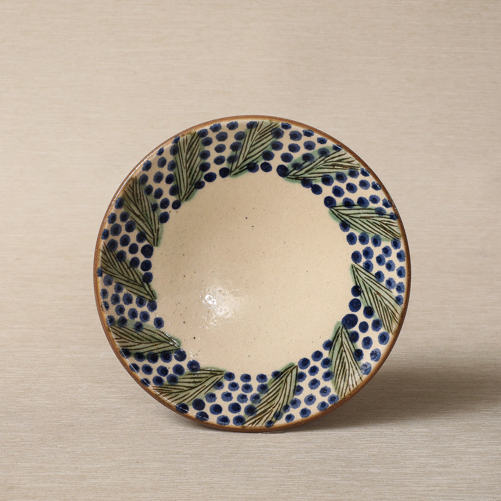 Hand painted plate with wreath decorated edge