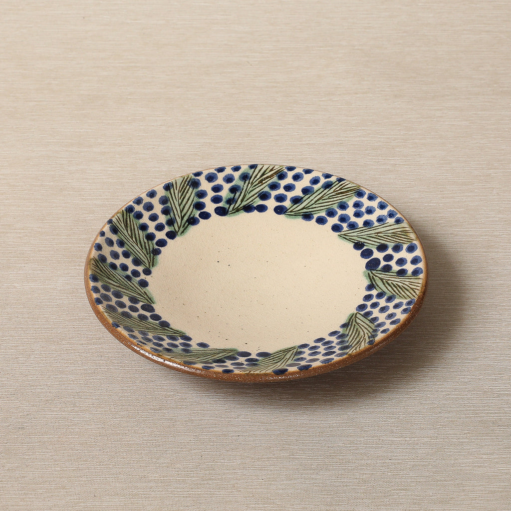 Hand painted plate with wreath decorated edge