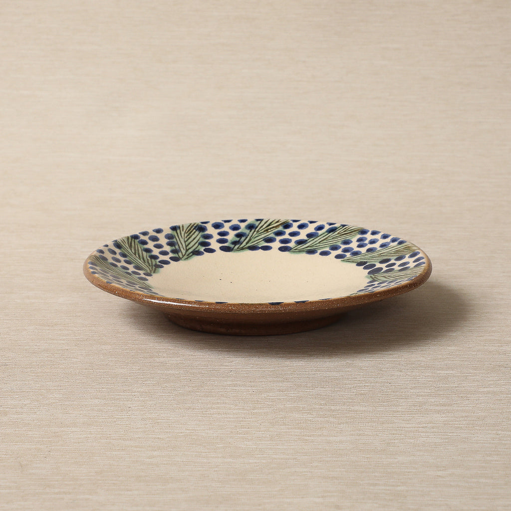 Hand painted plate with wreath decorated edge