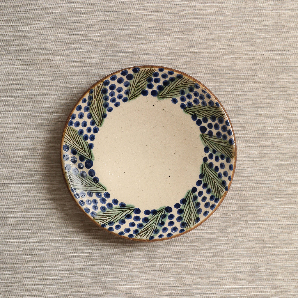 Hand painted plate with wreath decorated edge