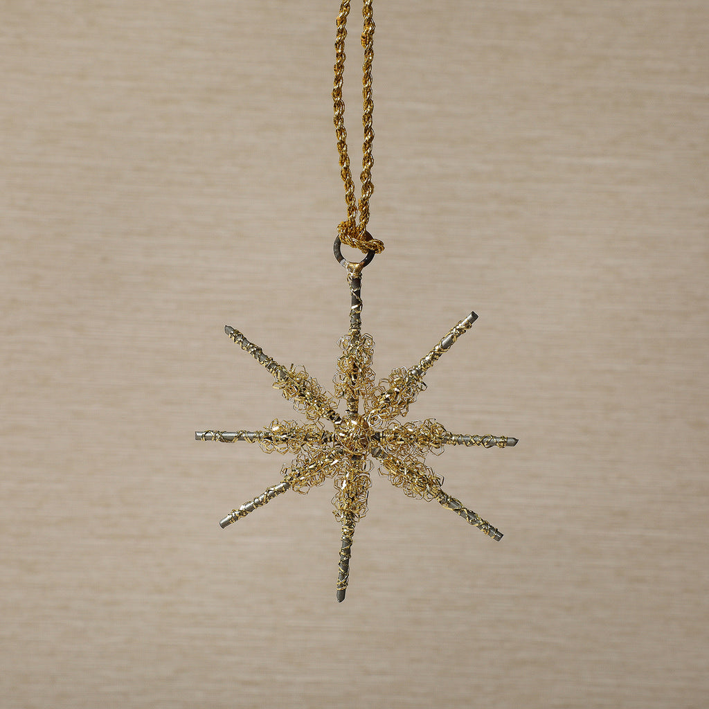 Assorted gold tinsel star ornament