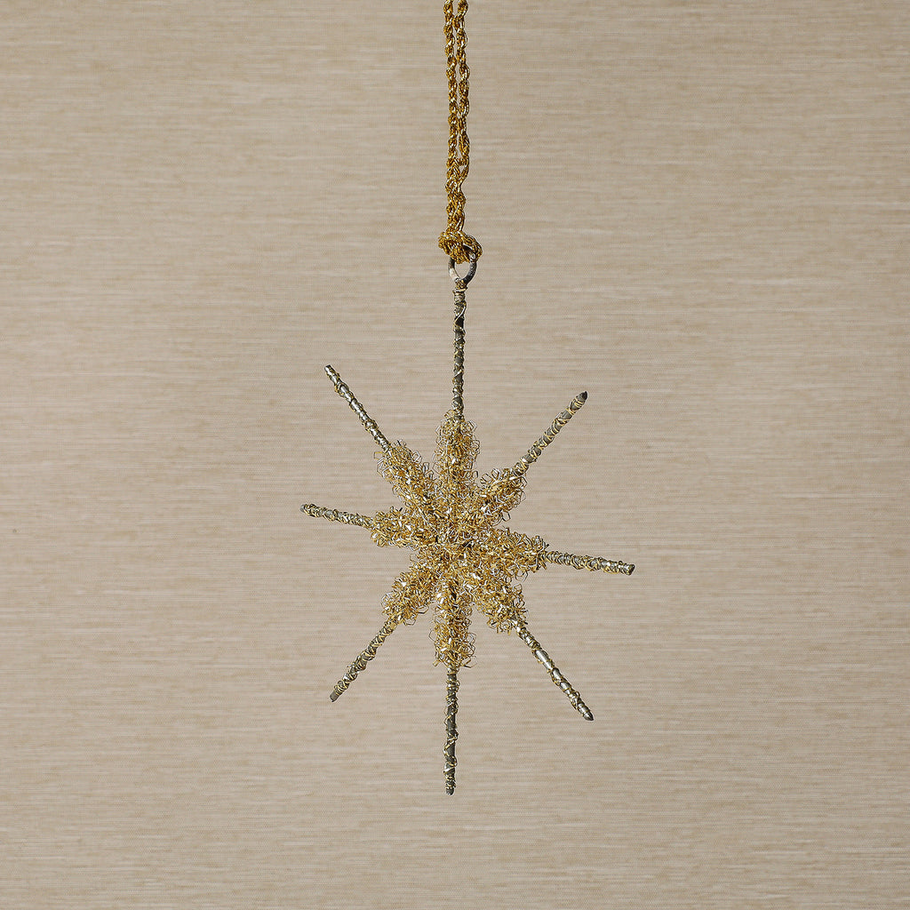 Assorted gold tinsel star ornament