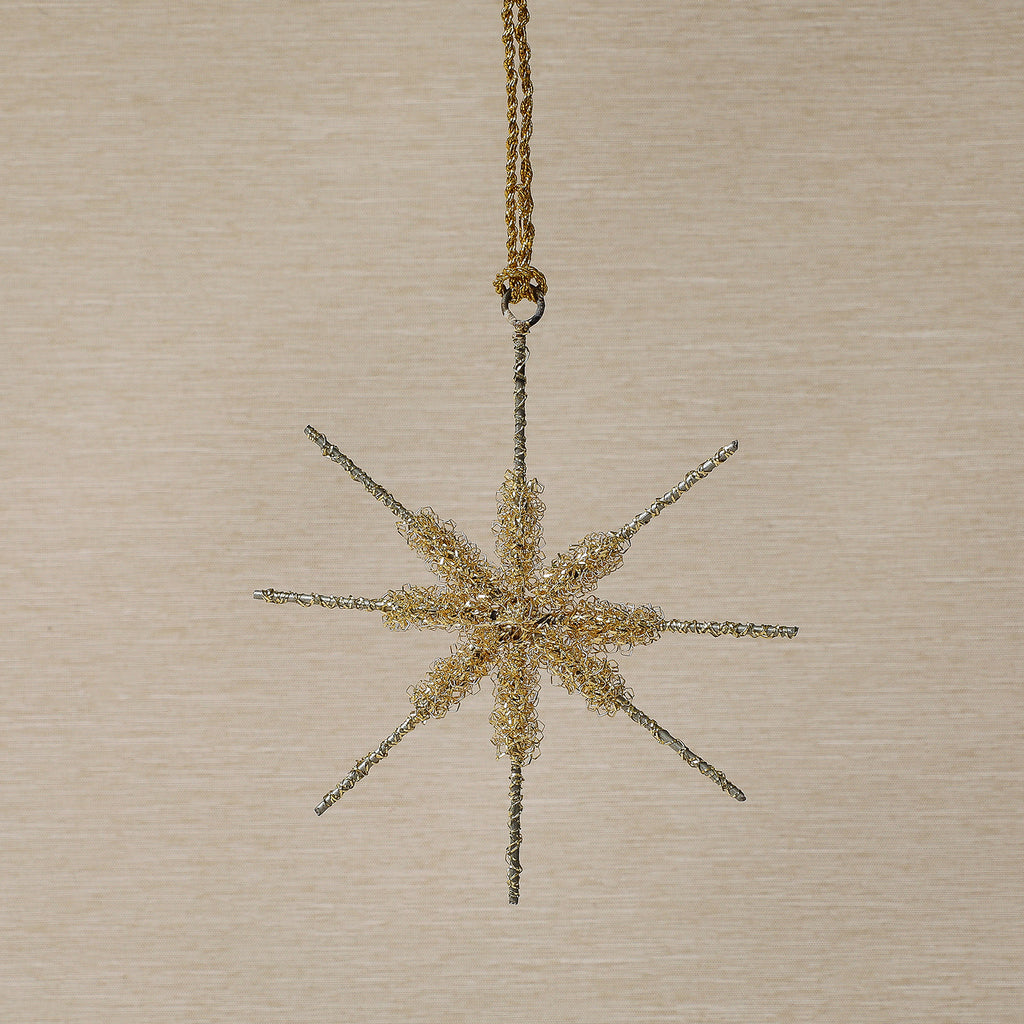 Assorted gold tinsel star ornament