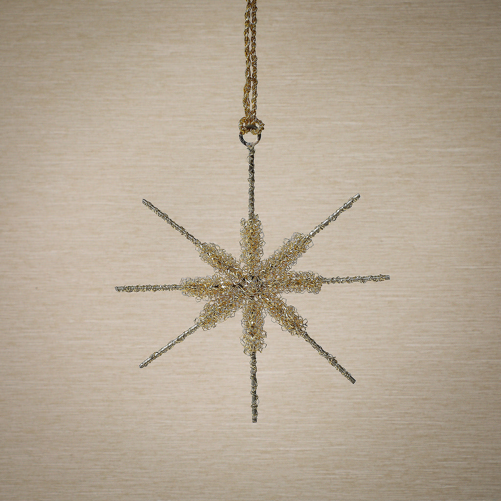 Assorted gold tinsel star ornament