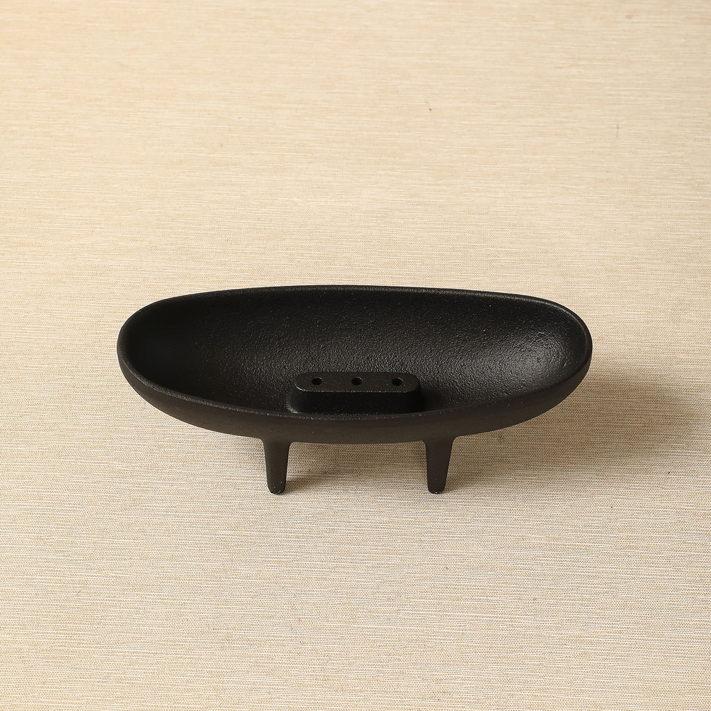 Elliptical incense holder with tripod base