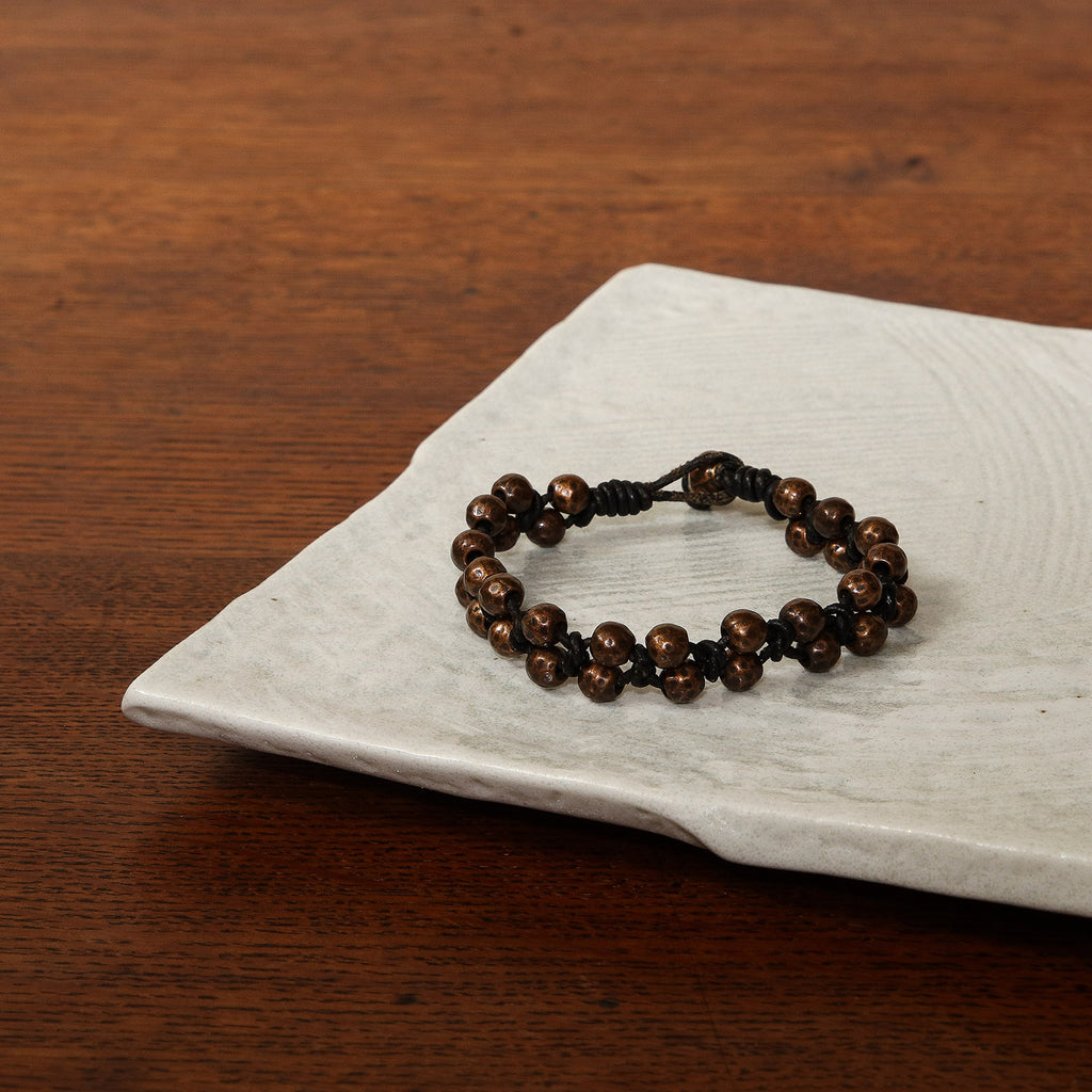 Bronze bead and cord bracelet