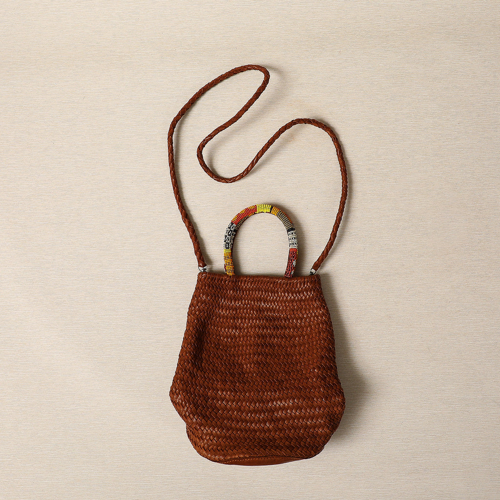 Woven Cognac lamb leather barrel bag