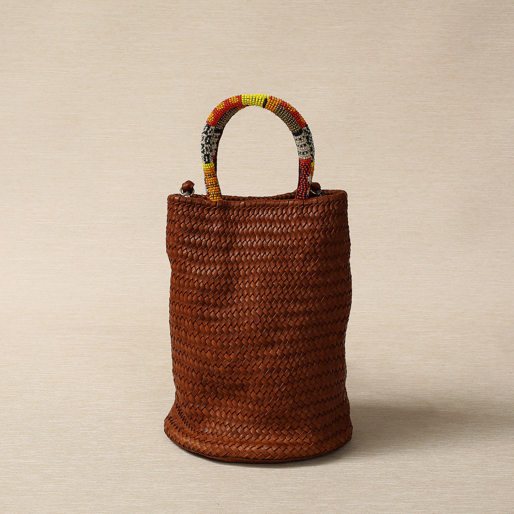 Woven Cognac lamb leather barrel bag