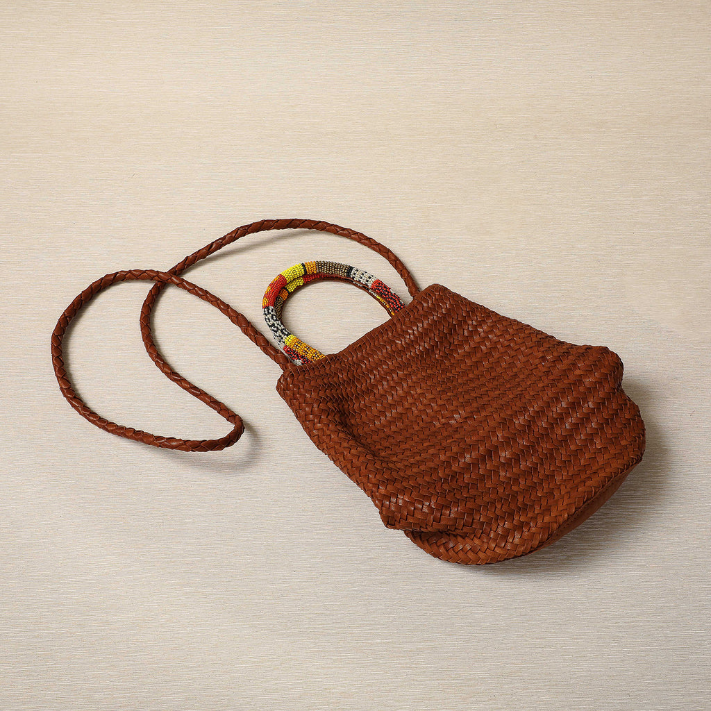 Woven Cognac lamb leather barrel bag