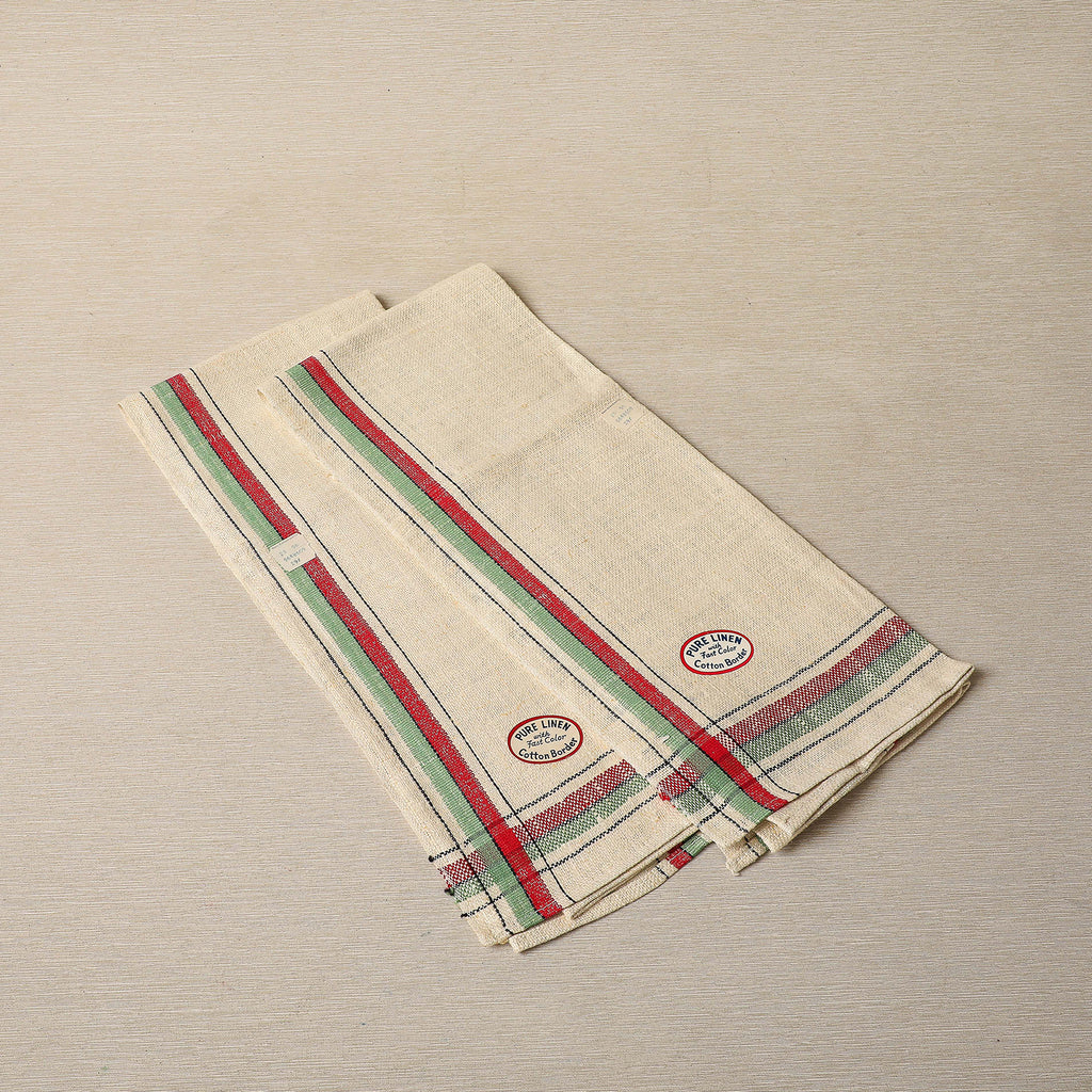 Charming vintage linen tea towel with red, green, and black borders and homespun texture c. 1940