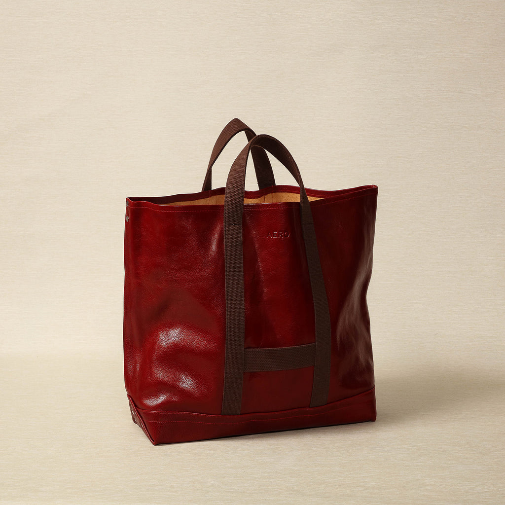 Aero leather utility bag in red with brown webbing