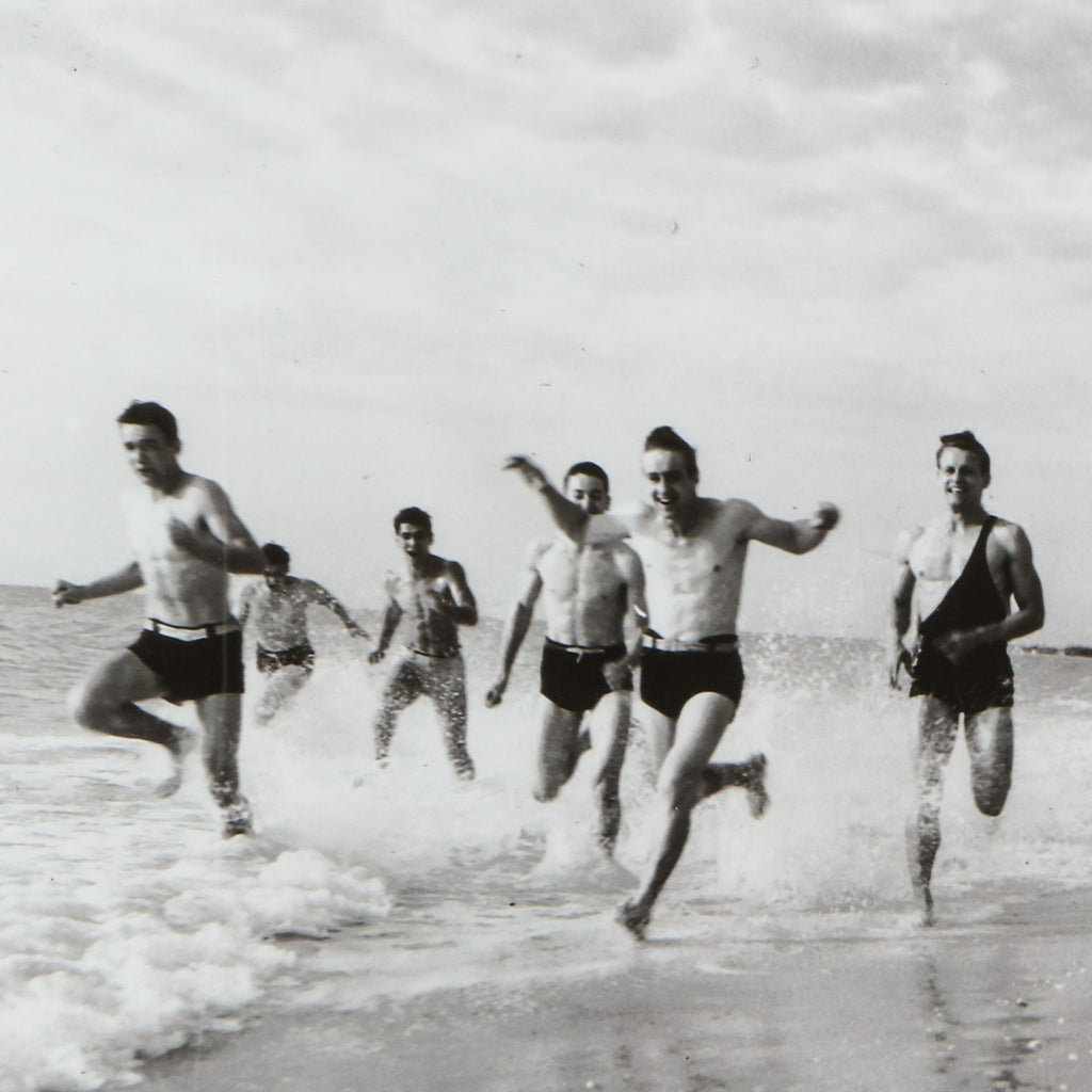 Lifeguards running on the beach