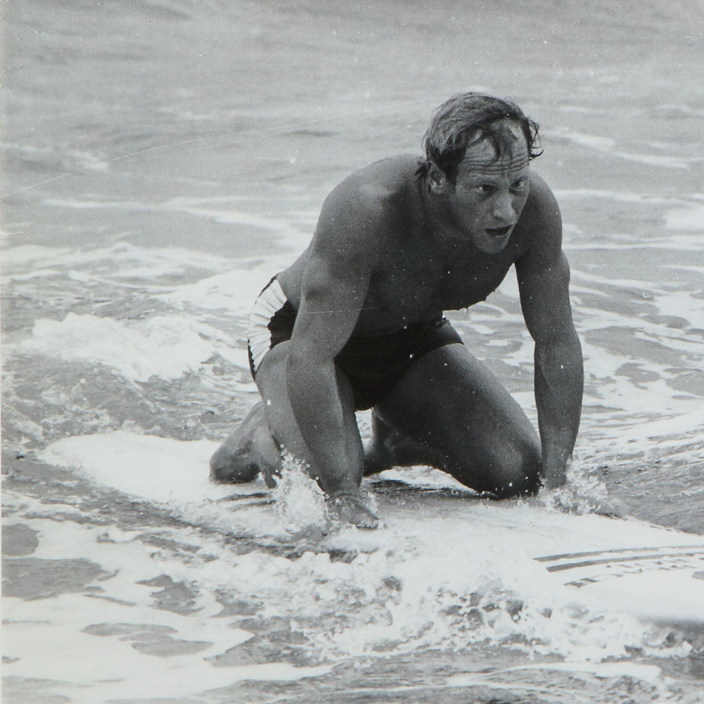 Surfer kneeling on his surfboard print