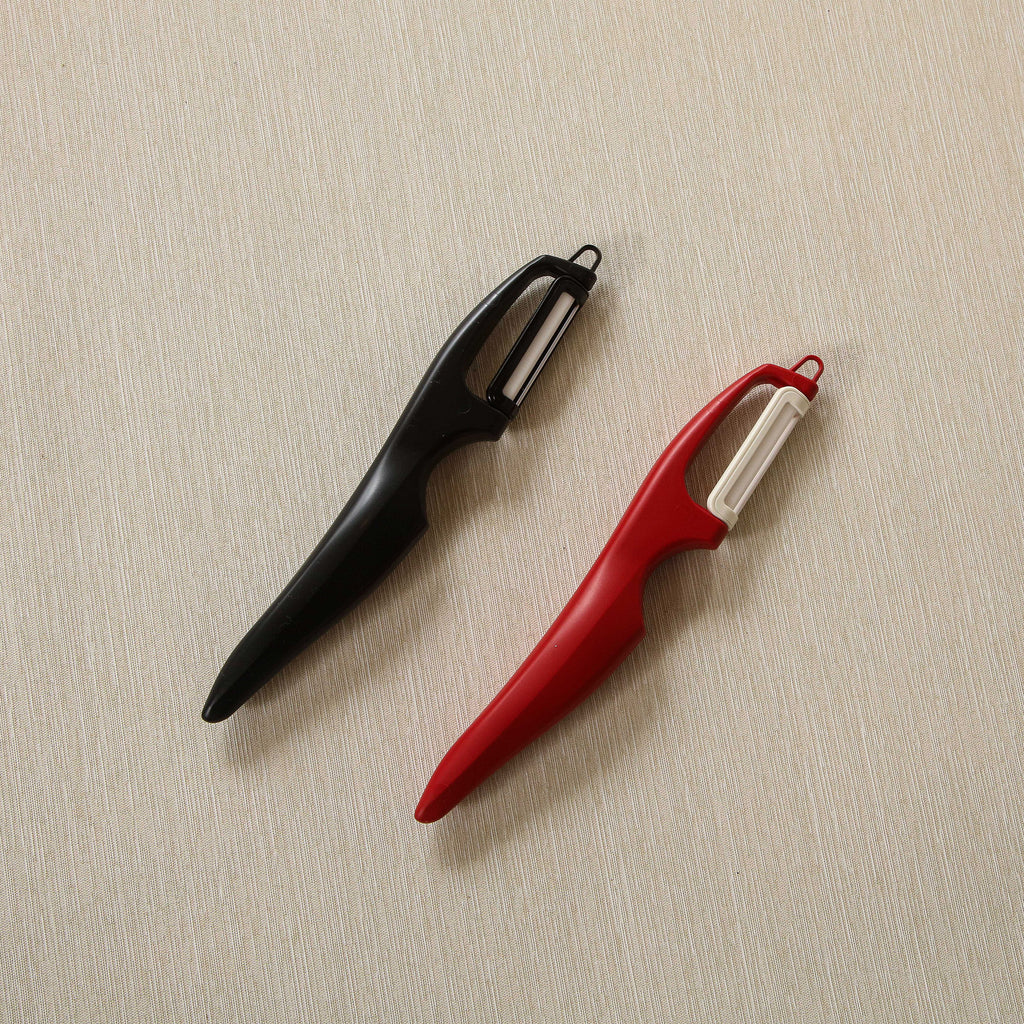 Vertical double edge ceramic peeler