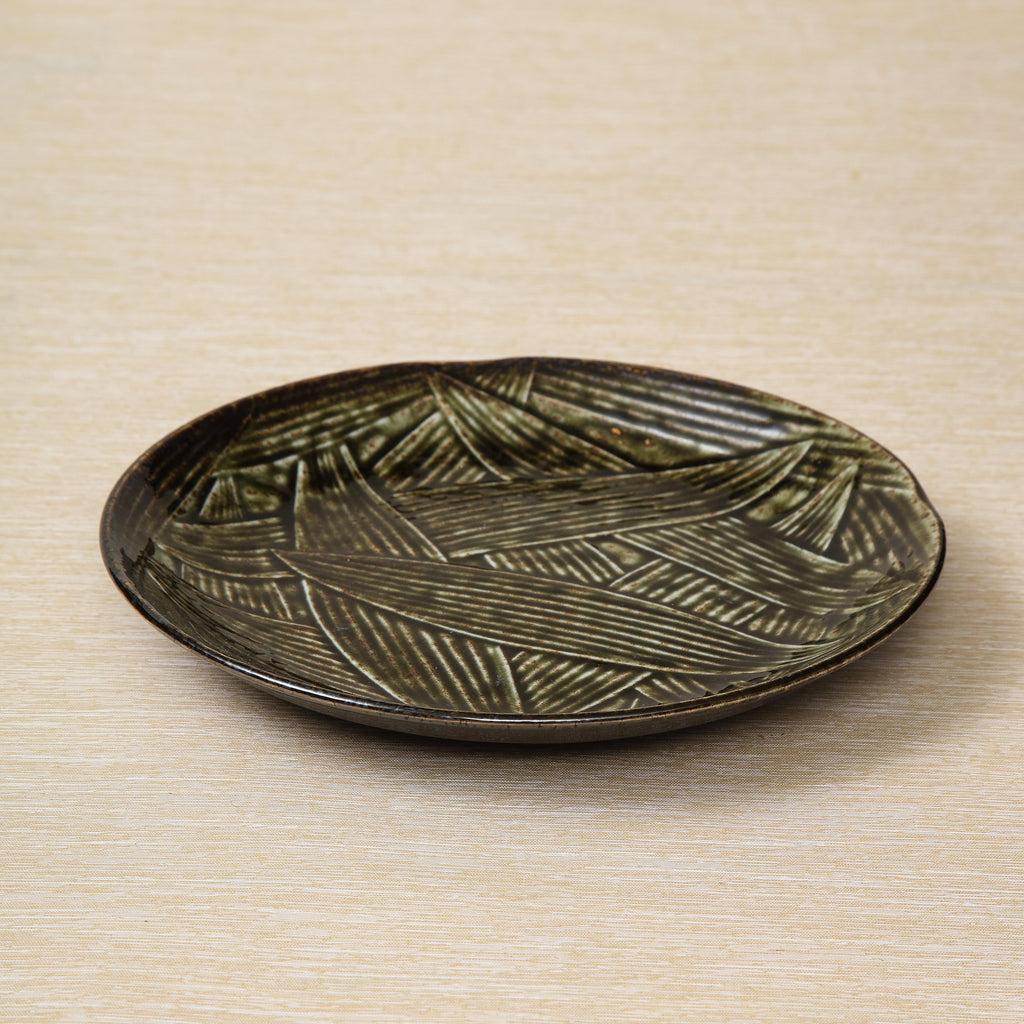 Kelp glaze dinner plate with falling leaves motif, Japan