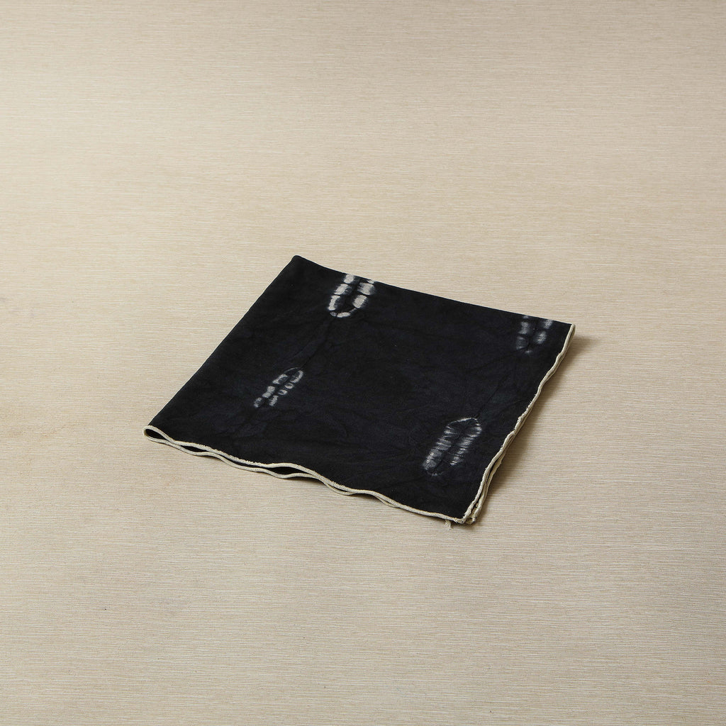 Black tie-dye napkin with ecru bourdon edge